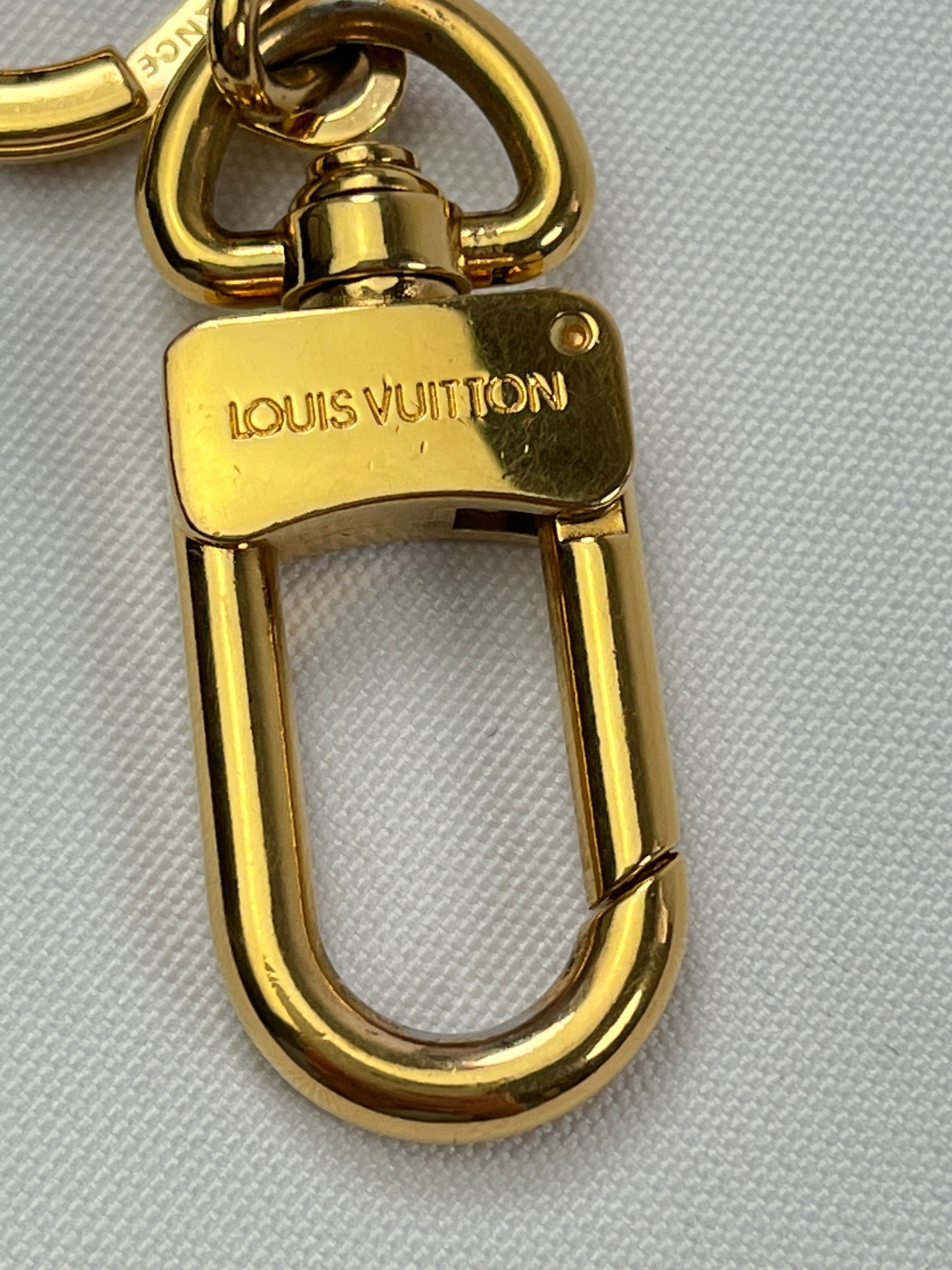 LOUIS VUITTON Goldtone Bolt Key Hold And Bag Extender - The Purse