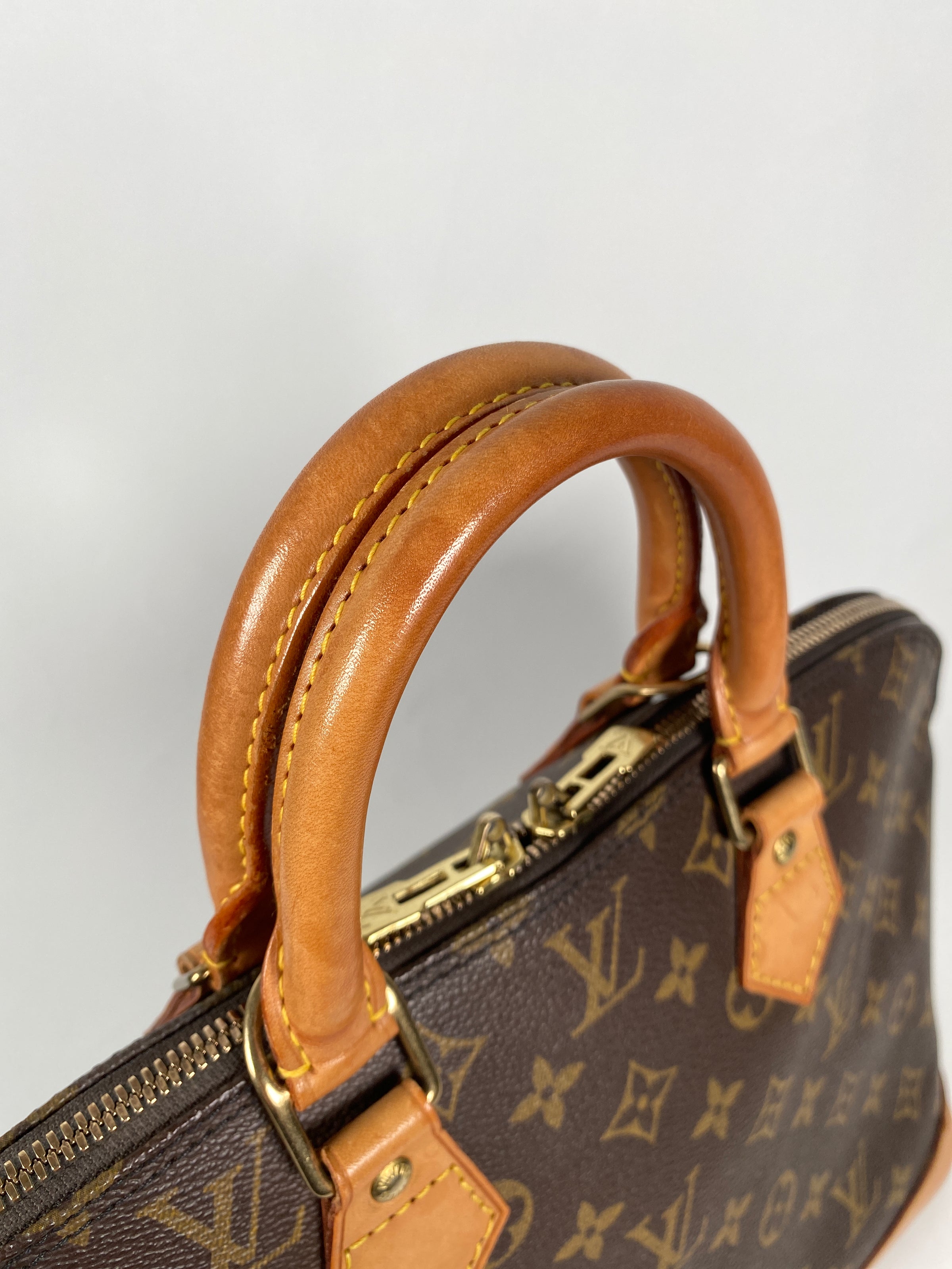 At Auction: LOUIS VUITTON Handbag ALMA PM, Coll.: 2014.