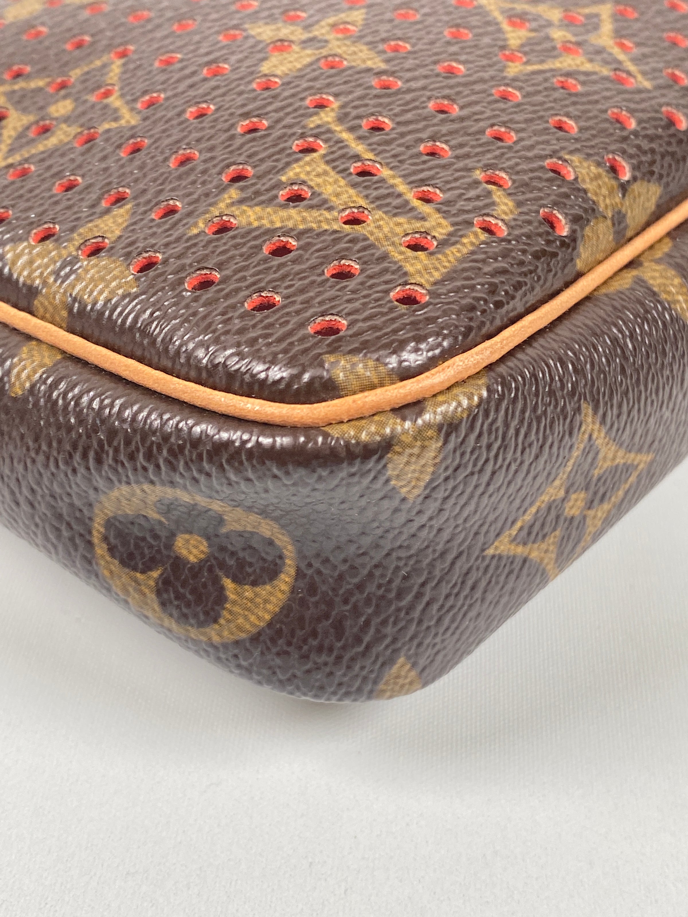 Louis Vuitton Limited Edition Monogram Canvas Perforated Pochette (SHF –  LuxeDH