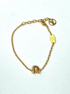 LOUIS VUITTON - LV & ME GOLD TONE BRACELET, LETTER R